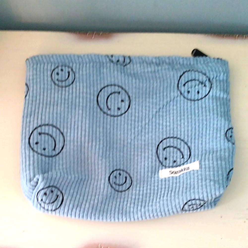 # Adorable Blue Corduroy Smiley Face Makeup Pouch